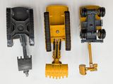 three toy construction vehicles that are next to each other