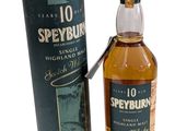 a bottle of speyburn scotch whisky next to a cardboard box