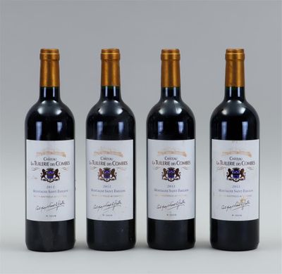 three bottles of wine are lined up on a table