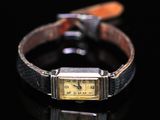 an image of a watch on a black surface