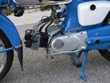 a blue motorcycle parked on the side of the road