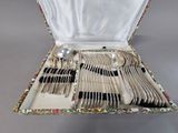 a box with a bunch of silverware in it