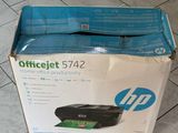 a box that is sitting on the floor with a printer in it