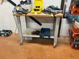 a picture of a workbench in a garage with tools on it
