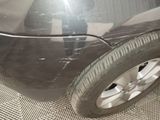 a close up of a car ' s tire on the ground