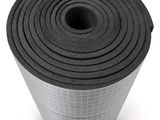 a close up of a roll of black felt on a white background