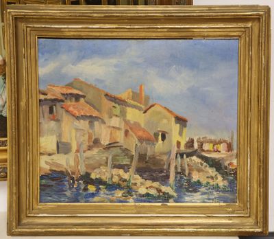 a painting of a village by the water in a gold frame