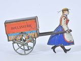 a toy of a woman pulling a cart with a bird on it