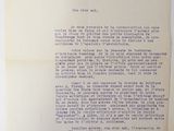 an old document with a pencil on top of it next to a piece of paper