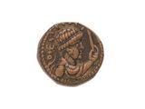 a close up of a coin with an image of a woman on it
