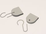 two hooks that are attached to each other on a white surface