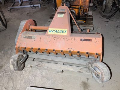 a machine that is sitting on the ground in the garage