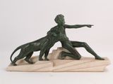 statue of a man and a dog on a marble base
