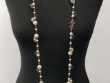 a close up of a mannequin torso with a necklace on it