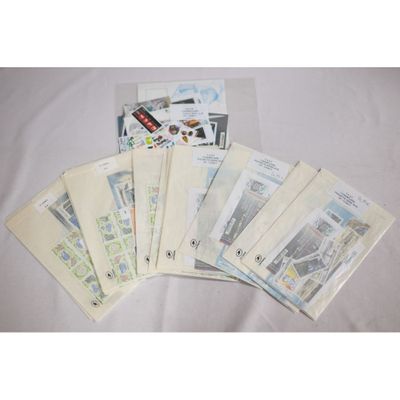 a lot of stamps and envelopes sitting on a table