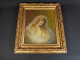 an oil painting of a woman with a veil in a gold frame