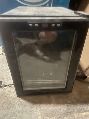 a small oven sitting on the floor in a room