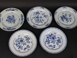 six blue and white plates with floral designs on them on a table