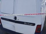a white van that is parked in a parking lot