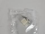 a plastic bag with a small piece of paper inside of it