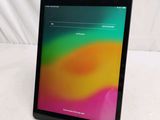 a tablet computer sitting on a table with a colorful background