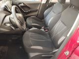 a red car with black seats and a steering wheel