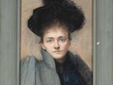 portrait of a woman in a black hat and blue dress