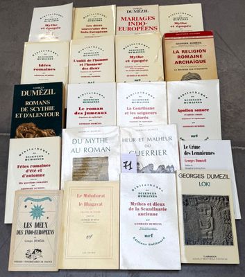 a lot of books that are sitting on the floor