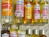 many bottles of different types of shampoos on a shelf