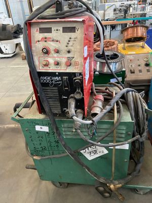 a machine that is sitting on a cart in a warehouse