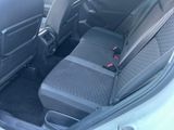 the back seats of a car with a seat belt in the back