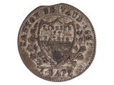 un gros plan d'une pièce de monnaie sur fond blanc, avec un blason