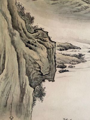 a painting of a man standing on a cliff by the water