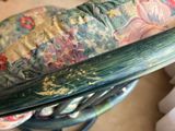 a close up of a surfboard on a chair in a living room