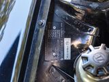 a close up of a car ' s engine with a badge on it