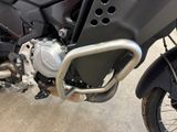 a close up of a motorcycle parked in a garage