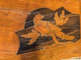 a wooden table with a carved design on it