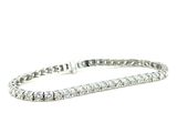 a close up of a diamond bracelet on a white background