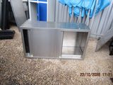 a metal cabinet that has a blue umbrella on top of it