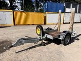 a trailer with a trailer attached to it in the dirt