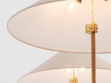 two white lamps with a rope wrapped around them on a white background