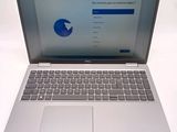 an open laptop computer sitting on top of a white table