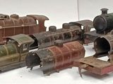a lot of toy trains that are sitting on a table