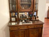 a wooden cabinet with a clock on top of it