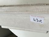 a white toilet with a sticker on the tank