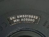 a close up of a tire with a number plate on it