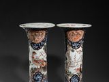 pair of chinese vases on a black background with a black background