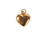 a gold heart charm on a white background