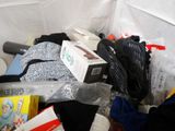 a pile of clothing and other items that are in a bag
