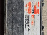 a box with a red cross on it sitting on the ground